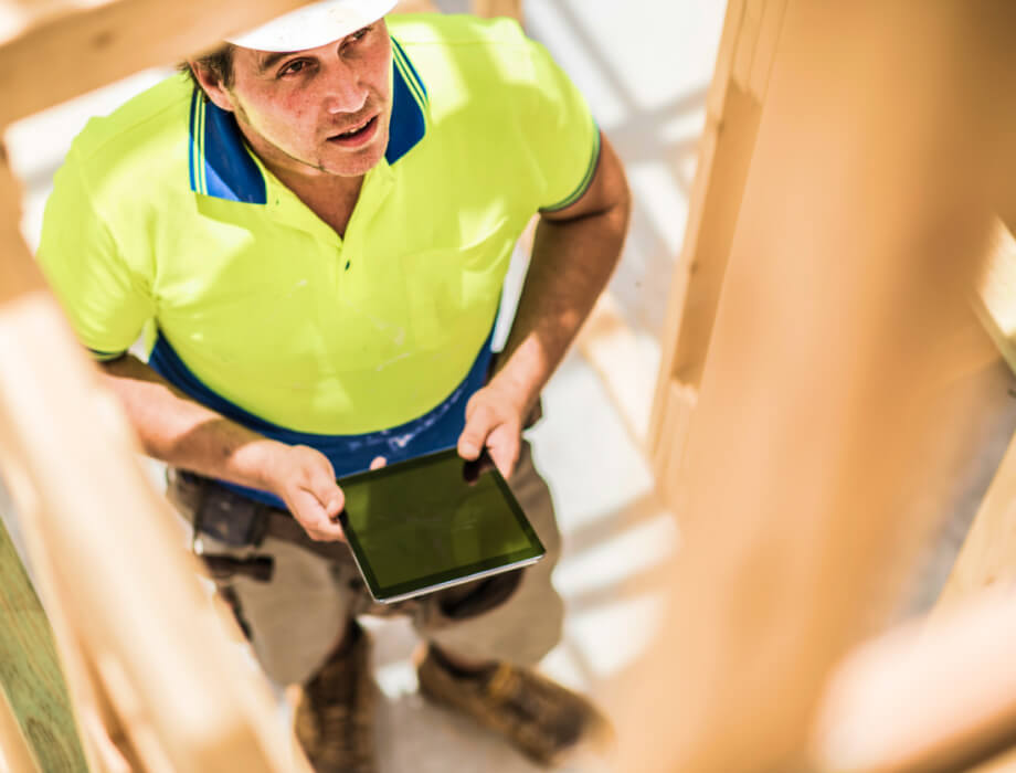 Construction worker using tablet